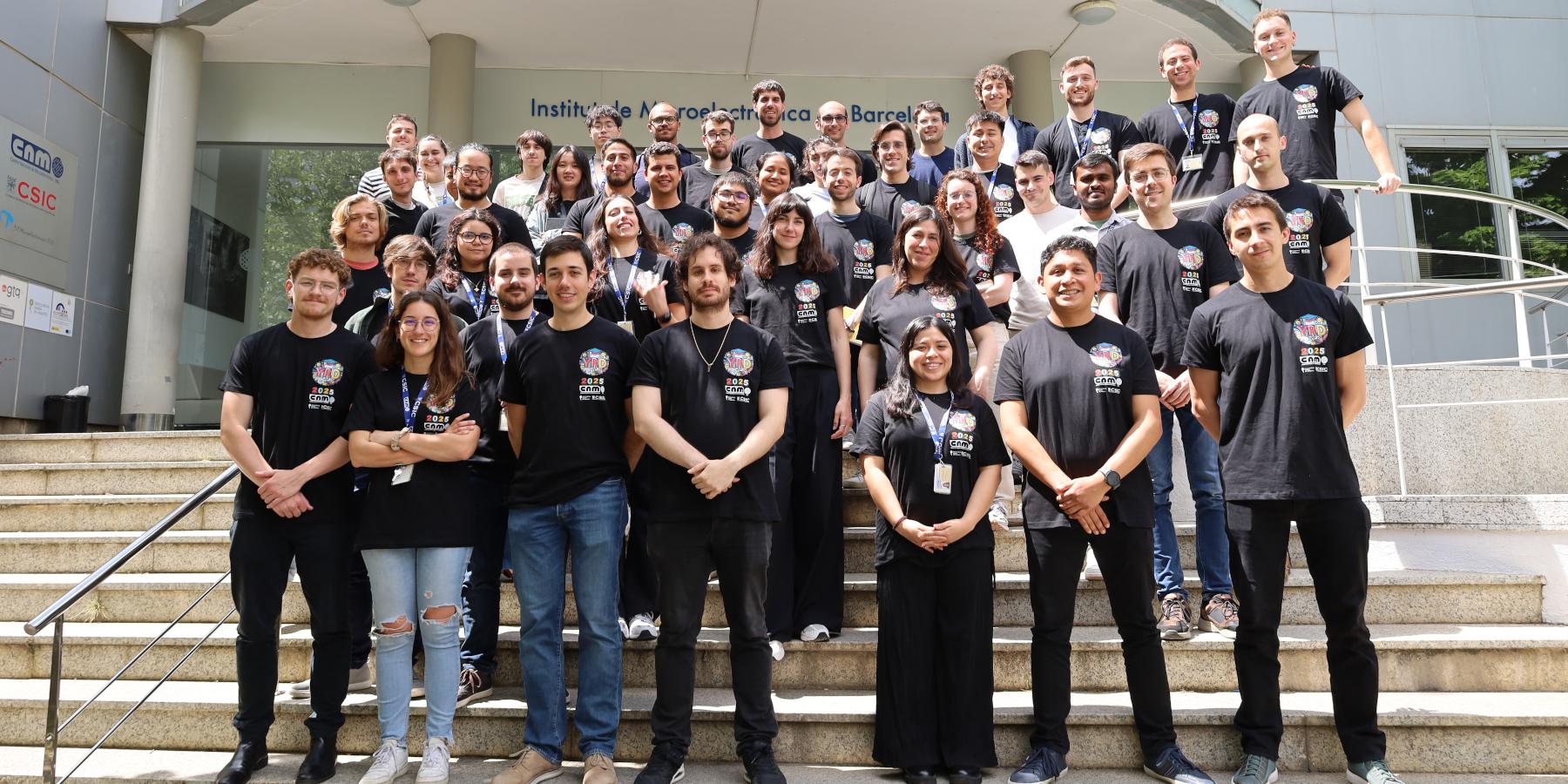 Young Researchers Day 2025 group picture with people at IMB-CNM stairs